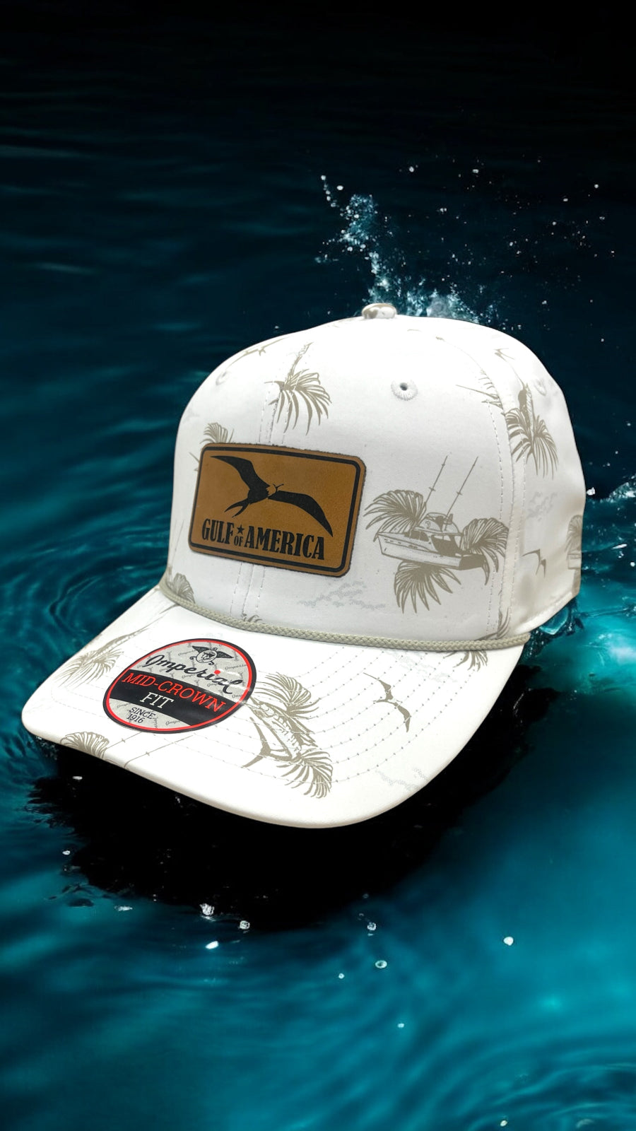 White cap with fishing-themed design and 'Gulf of Mexico' branding submerged in water.